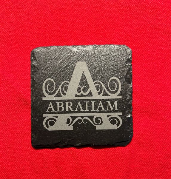 Slate coaster with "Abraham" engraved in decorative font for religious or biblical-themed decor.